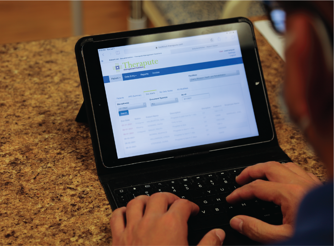 Person typing on a tablet with keyboard extension